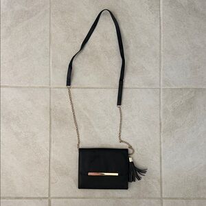 Elegant Black Crossbody Bag with Gold Accent